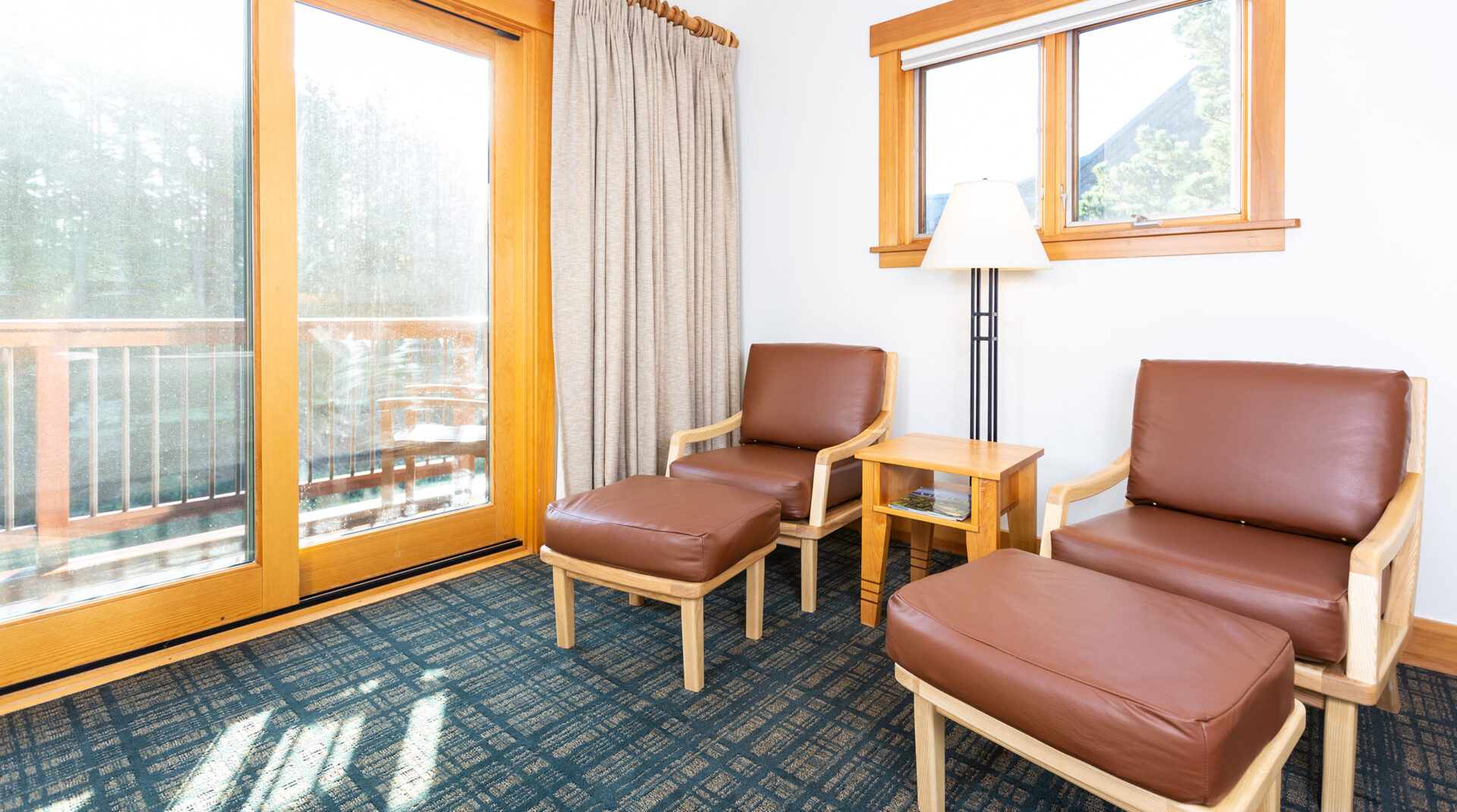 The warm seating area of a Lily Pond guestroom