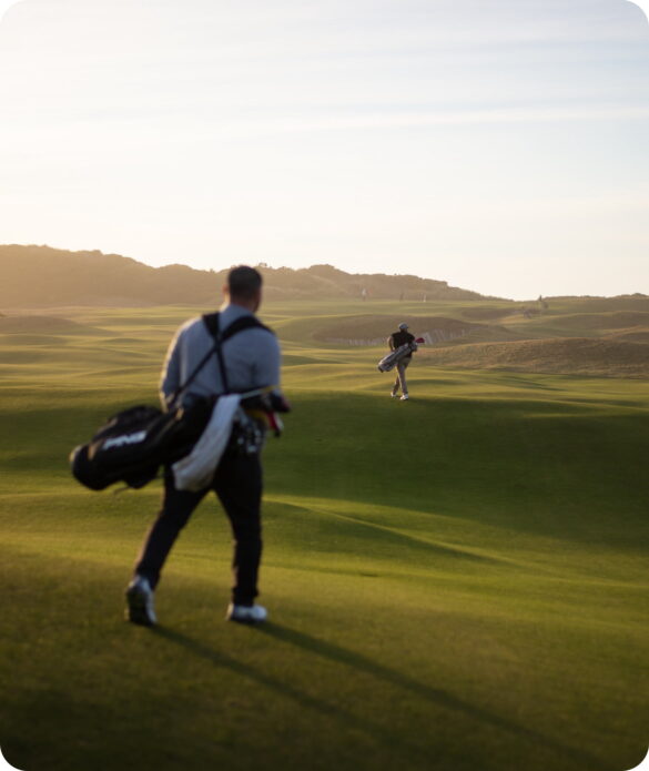 Two men walking the course grounds